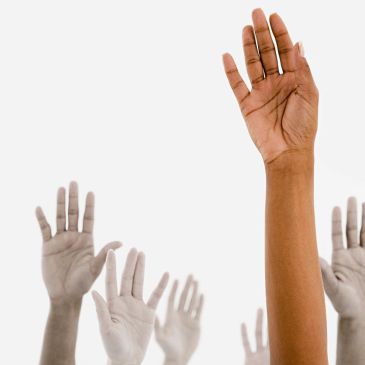 Hands raised in unity